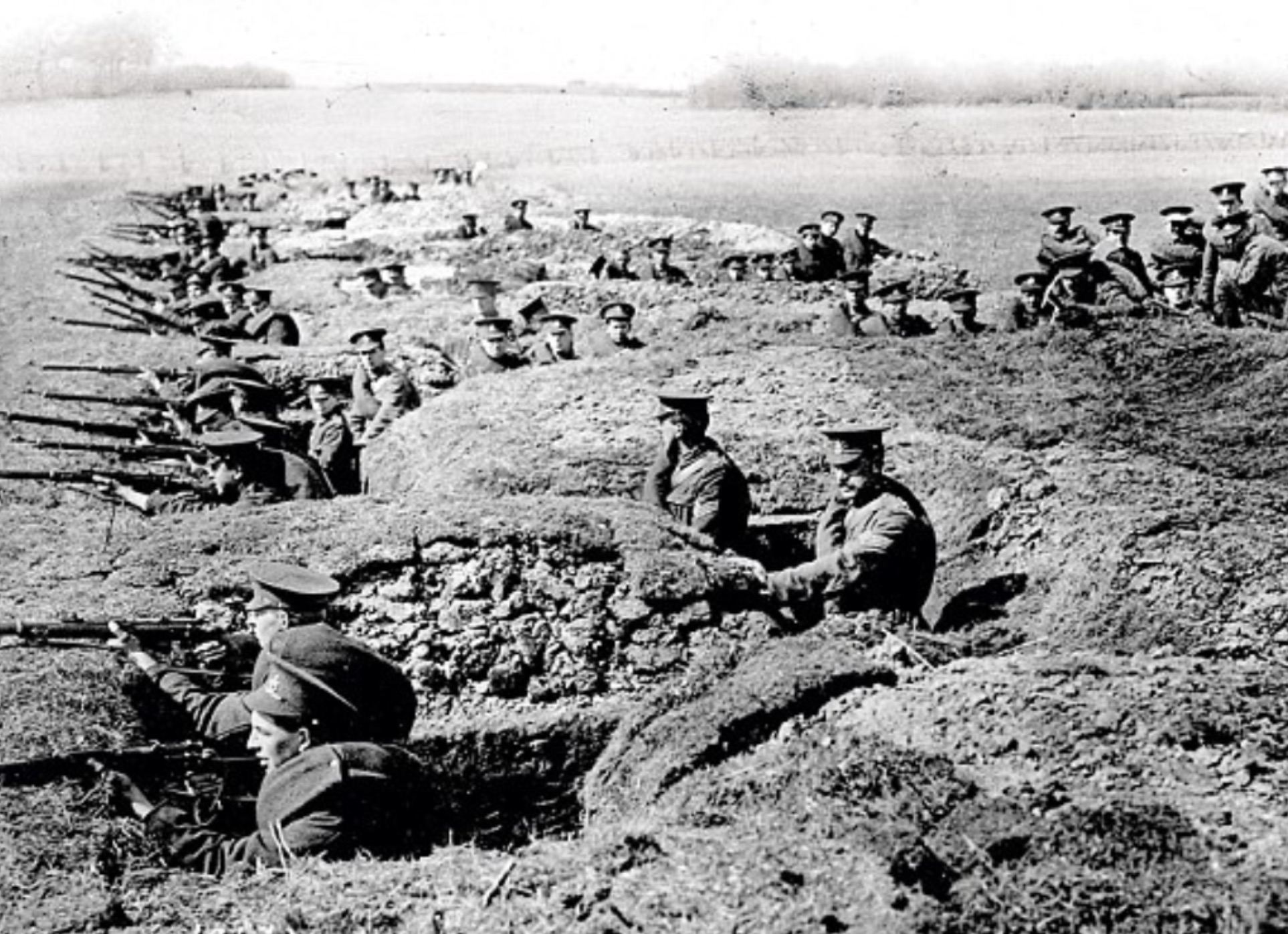 Soldiers training in trench warfare, with well-defined fire bays connected by offset traverse trenches 